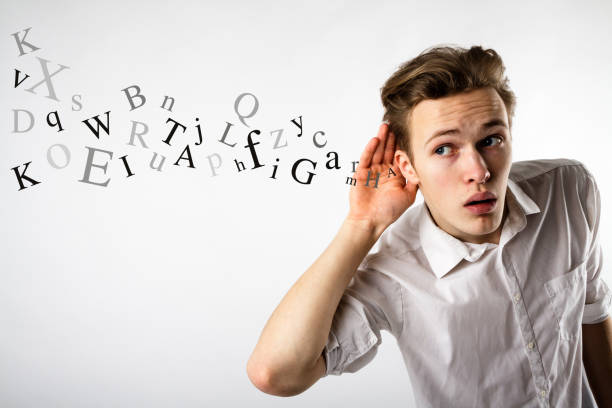 istock Curious young man in white is eager to know all the gossip. Curious man and letters. Information concept. 1133586206