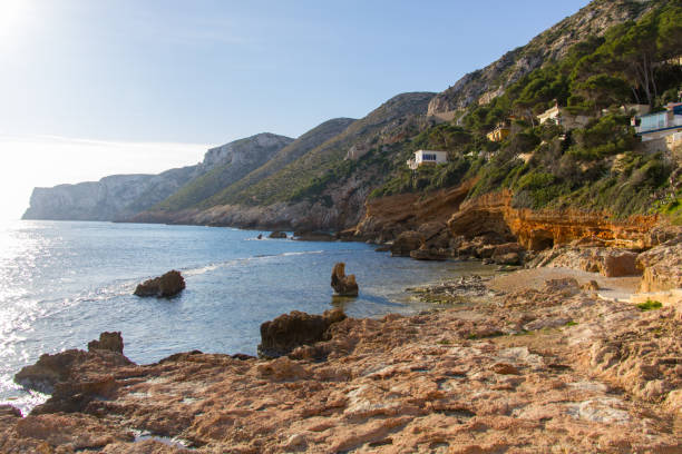 istock Las Rotas rocky beach in Denia, Spain at sunset 1133586810