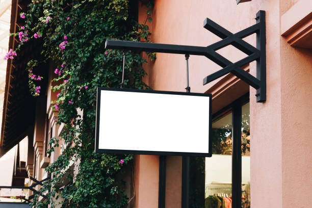 istock horizontal black empty signage on clothes shop front with copy space. 1133588678