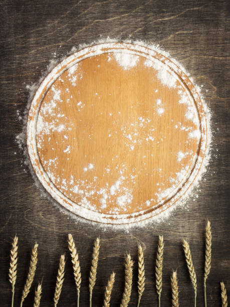 istock wheat grains and bakery ingredients on wooden background 1133589126