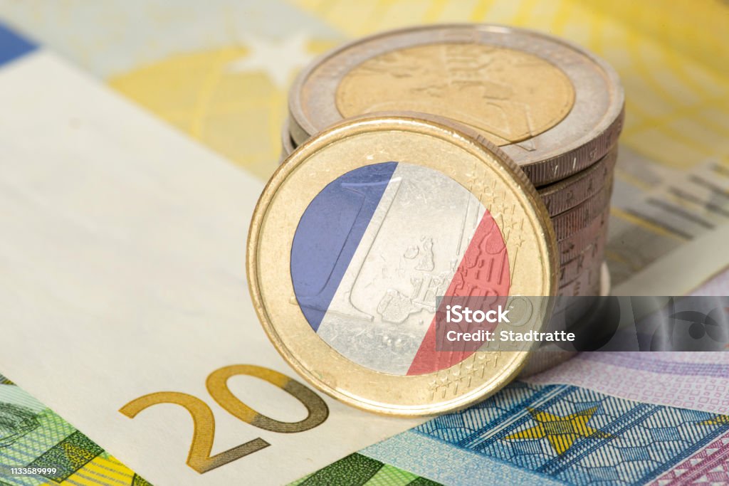 Euro notes and coins and flag of France Euro banknotes and coins and flag of France France Stock Photo