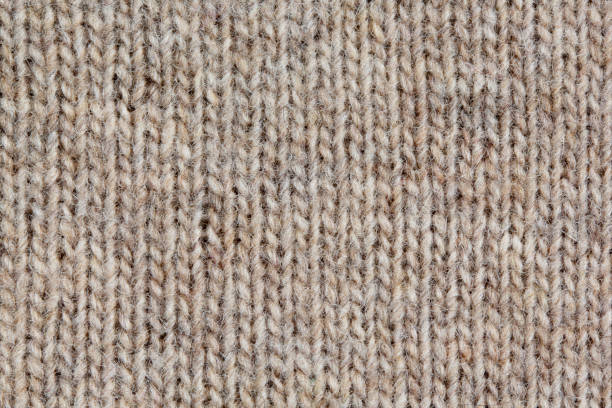 istock Knitted sweater, closeup neutral background 1133591856