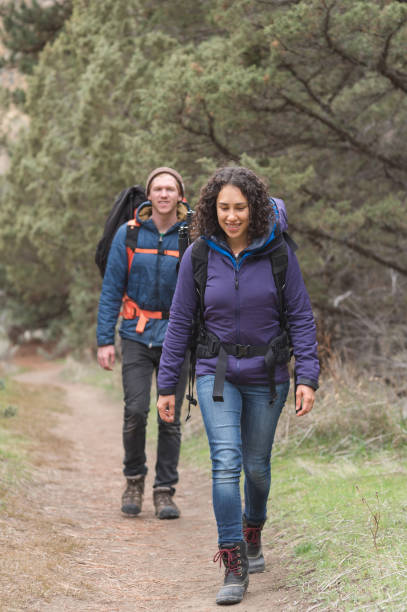 istock Two friends backpack along a dry wilderness trail together 1133591914