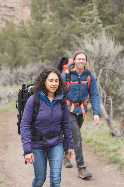 istock Two friends backpack along a dry wilderness trail together 1133591921