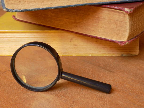 istock Magnifying Glass with books II 1133592058