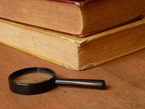 Magnifying Glass with books IV