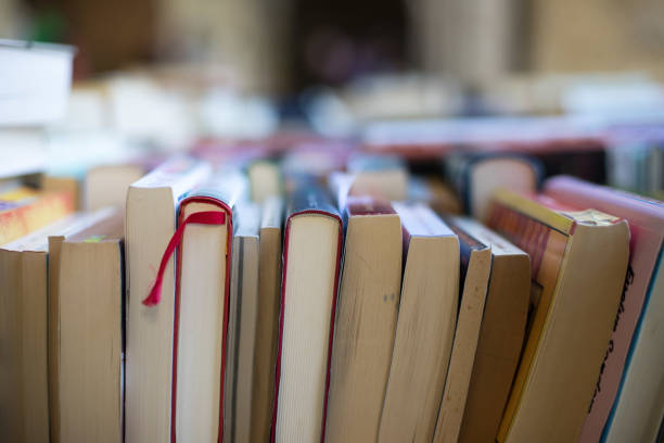 istock Stack of books at a charity book flea market, text space 1133594145