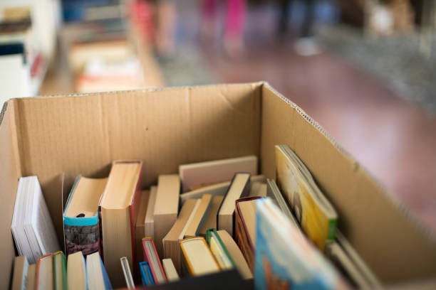 istock Stack of books at a charity book flea market, text space 1133594178