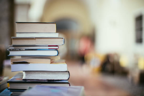 istock Stack of books at a charity book flea market, text space 1133594215
