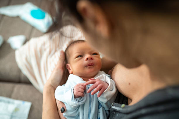 istock Mother holding newborn baby 1133595319