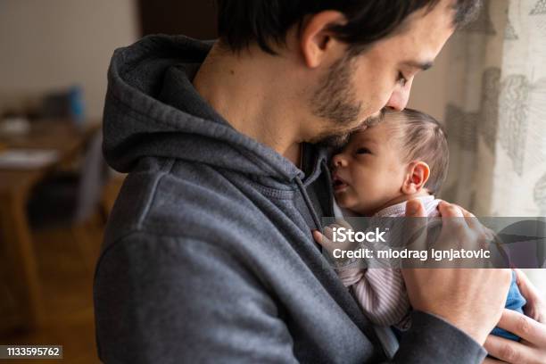 Proud Father Kissing Newborn Son Stock Photo - Download Image Now - Father, Baby - Human Age, Newborn