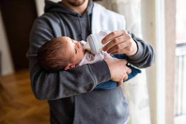 istock Father feeding newborn baby 1133595766