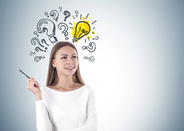 istock Woman with pen, question marks, lightbulb mock up 1133595805