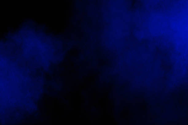 istock Bizarre forms of blue powder explode cloud on white background. Launched blue dust particles splashing. 1133597337