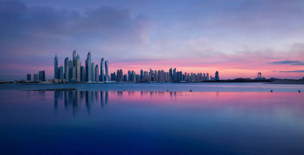 istock Skyline of Dubai Marina at a beautiful sunset with an infinity pool in front 1133598003