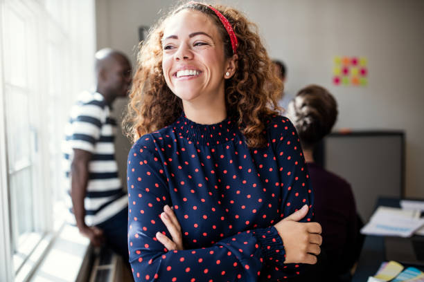 istock Laughing young designer standing in an office after a meeting 1133598751