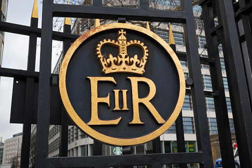 London, England - February 28, 2019:  Elizabeth II Regina ER royal insignia on the gate of the Tower of London, England.
