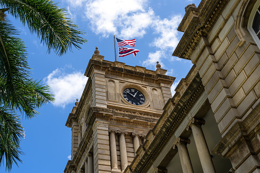 Upward view of the clock tower on the supreme court building in Honolulu Hawaii - Ali'iolani Hale