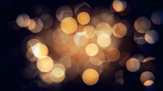 Abstract isolated blurred festive yellow and orange Christmas lights with bokeh
