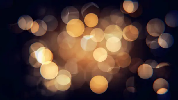 Photo of Abstract isolated blurred festive yellow and orange Christmas lights with bokeh