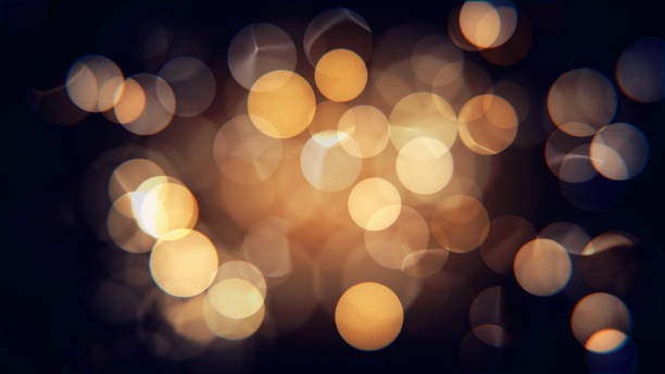 luzes de natal amarelas e alaranjadas desfocada isoladas abstratas com bokeh - christmas lighting equipment abstract christmas lights - fotografias e filmes do acervo