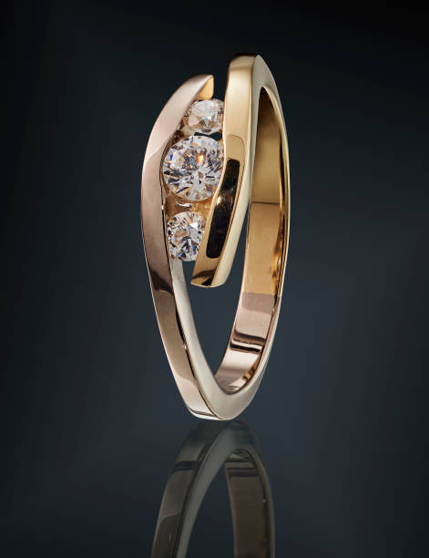 istock Golden ring with gemstone isolated on black background 1133602974