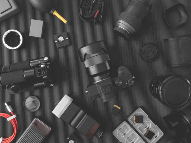 istock top view of work space photographer with digital camera, flash, cleaning kit, memory card, external harddisk, USB card reader, laptop and camera accessory on black table background 1133603837