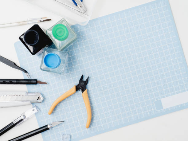 istock top view of hobbies concept with cutting mat and tool kits on white background with copy space. 1133603898