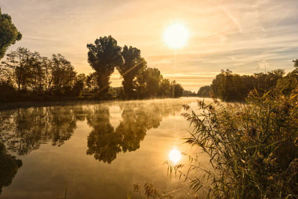 Sunrise over misty river Regnitz at Bamberg, Bavaria