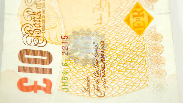 istock Side view of the 10 Pounds bill on the table 1133606316