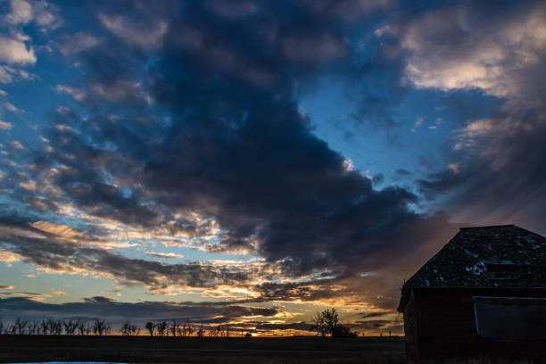 istock Sunset over a farmers field, Gliechen, Alberta, Canada 1133606320