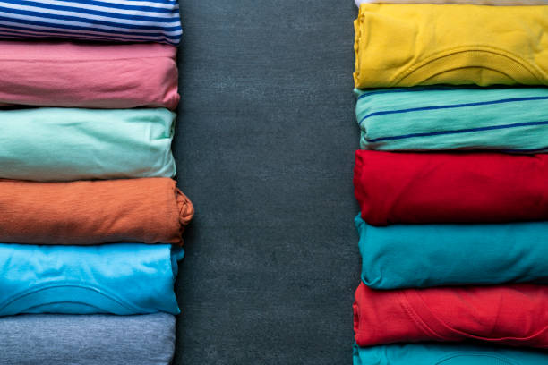 istock close up of rolled colourful clothes on black background 1133606849