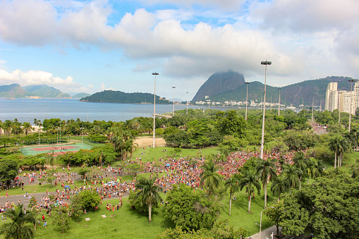 People from the famous Toco Xona block passing through Aterro do Flamengo, one of the most popular places of leisure in the city of Rio de Janeiro.