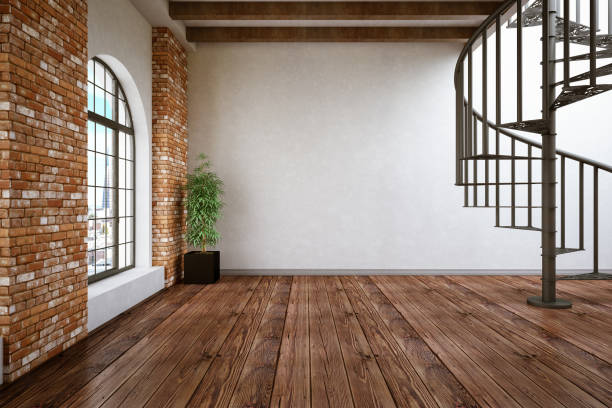 Sunlight illuminating an empty room with parquet flooring and open windows overlooking a garden