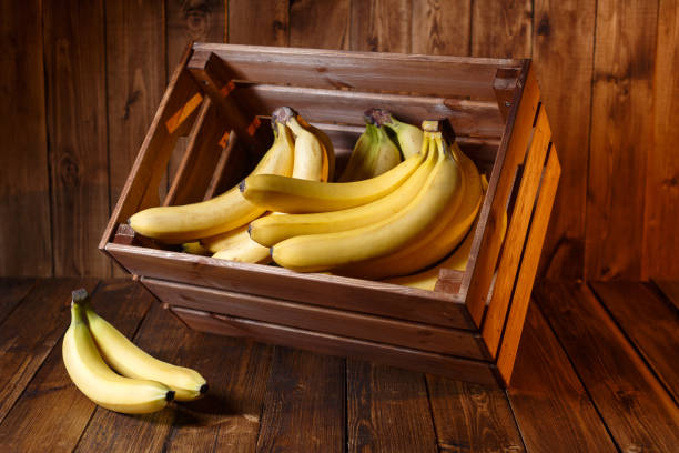 istock Bananas in a crate on rustic wood table 1133613122