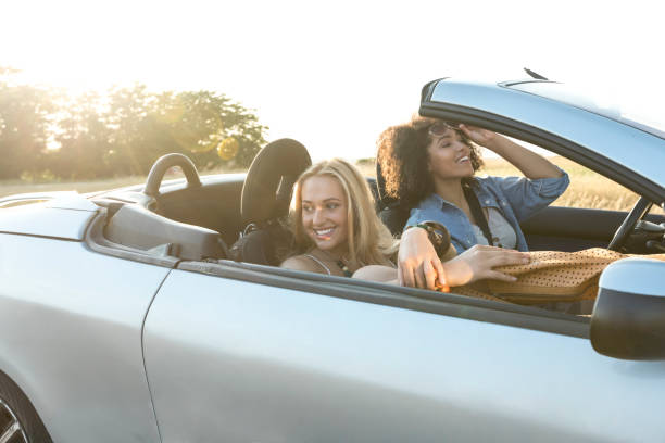 istock Two beautiful women traveling with cabriolet 1133616397