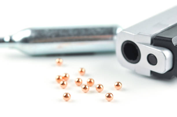 Air Gun, Co2 Cartridges and Pellets. Focus on a front pellets with shallow dof.