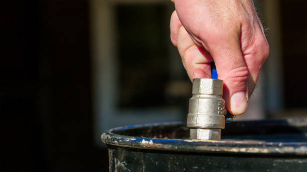 istock Turning off the faucet from the water drum 1133618829