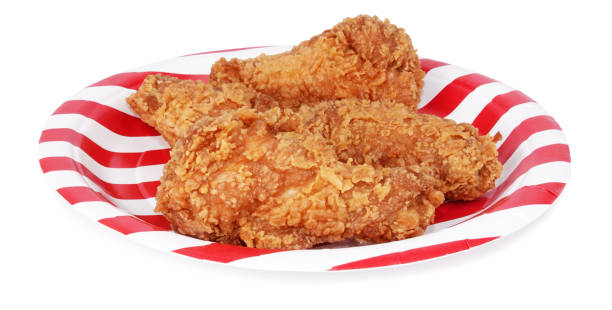 istock Fried chicken pieces nuggets on plate isolated white background 1133620043
