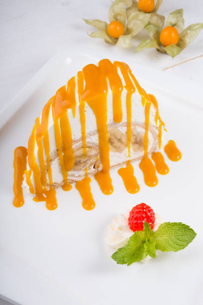 istock White spoonge peice of cake with orange syrup 1133621783