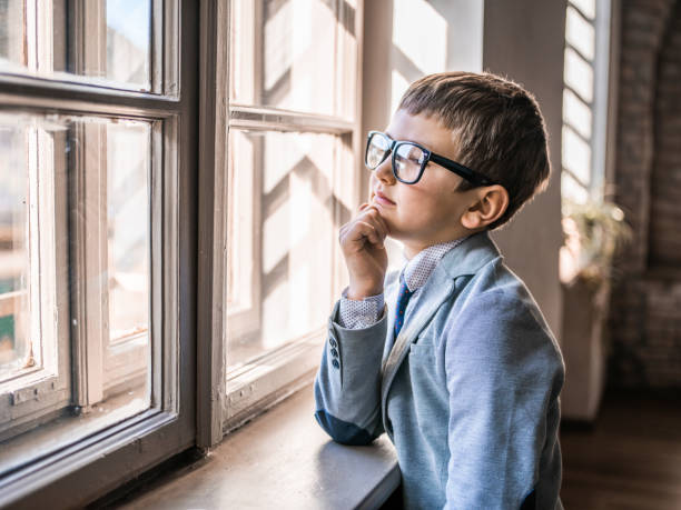 istock Little boy in the office near window 1133621822