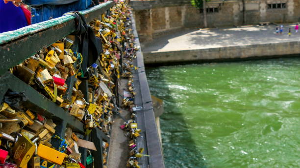 istock Different kinds of padlocks locked on the bridge 1133621965