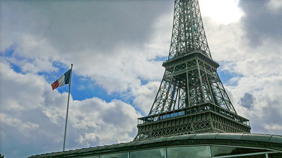 The Eiffel tower in a late afternoon scene. The ever famous tower in Paris France