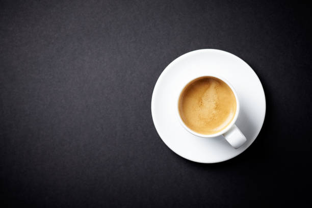istock Cup of coffee on black background. Directly Above. Copy space. 1133623563