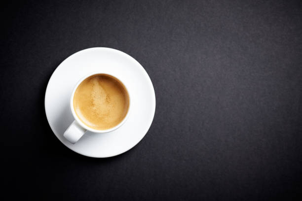 istock Cup of coffee on black background. Directly Above. Copy space. 1133623629