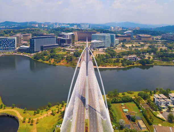 Seri Wawasan Bridge or Putra Bridge and Putrajaya Lake with blue sky. The most famous tourist attraction in Kuala Lumpur City, Malaysia