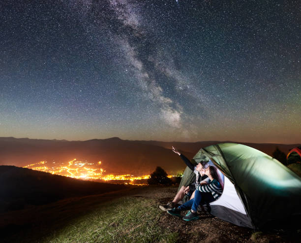 istock Couple tourists resting at night camping under stars 1133634186
