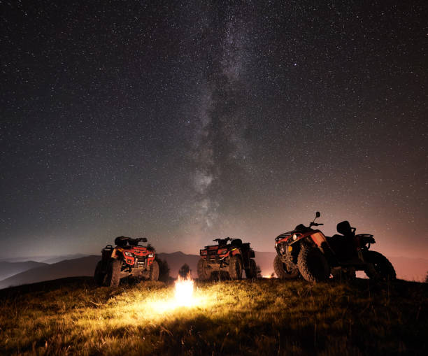 istock Atv quad motorbikes in the mountains under night starry sky 1133634187
