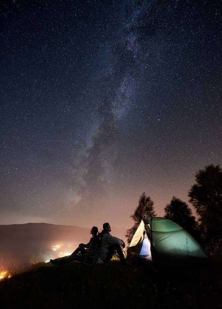 istock Couple tourists resting at night camping under stars 1133634191
