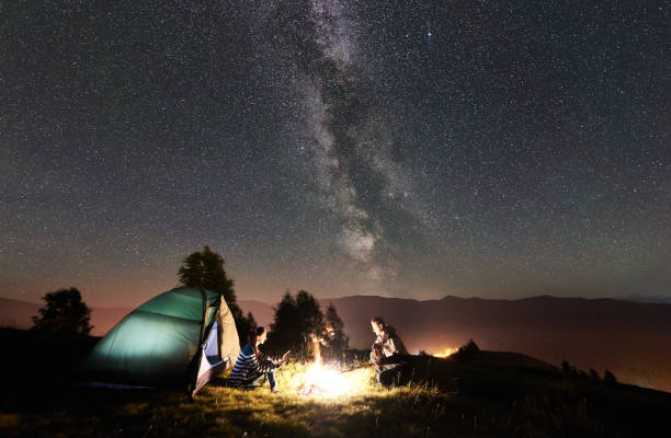 istock Couple tourists resting at night camping under stars 1133634193